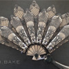 A Folding Fan with Lace: By RH. BAKE