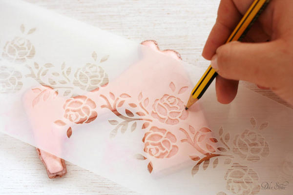 Using a stencils to trace roses: