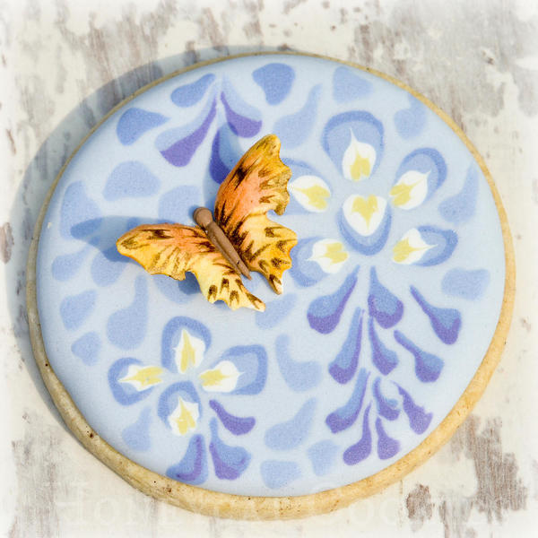 Butterfly attached to wisteria cookie