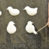 Step 1, Continued - Piping and Shaping Birds: Royal Icing Transfers and Photo by Honeycat Cookies