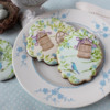 What a Difference Background Icing Color Can Make: Cookies and Photo by Julia M Usher; Stencils Designed by Julia with Confection Couture Stencils