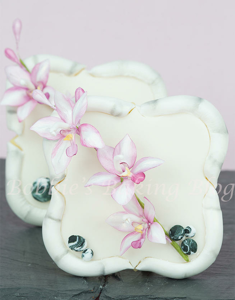 Bamboo Cookie Frame with Spathoglottis Orchids and Rocks