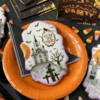 "Trick or Treat" Message in Oval Frame: Cookies and Photo by Julia M Usher; Stencils Designed by Julia M Usher with Confection Couture Stencils