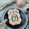 First Cookie in Orange-and-Black Series with Messages: Cookie and Photo by Julia M Usher; Stencils Designed by Julia M Usher with Confection Couture Stencils