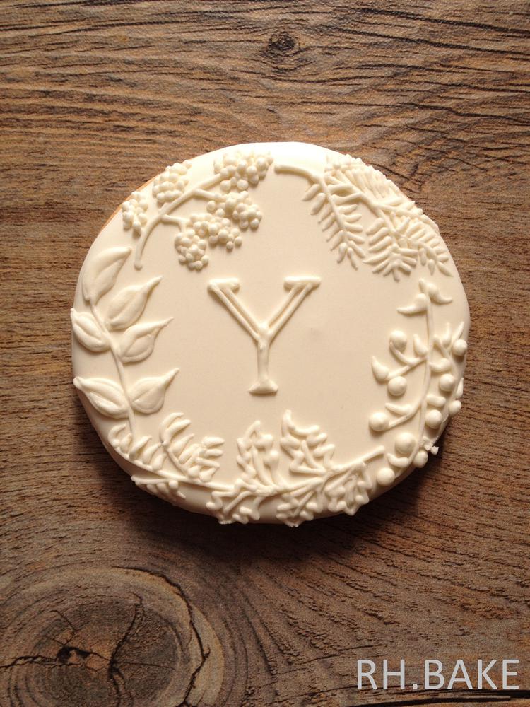 Botanical white on white initial cookie